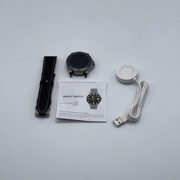 Smart watch with accessories including a strap, USB cable, and manual on a light gray background