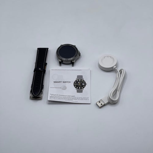 Smart watch with accessories including a strap, USB cable, and manual on a light gray background