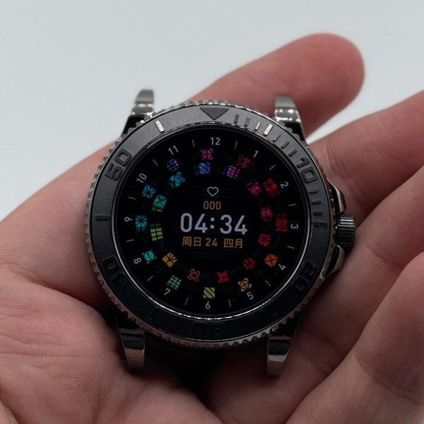 Smartwatch held in a hand with a white background