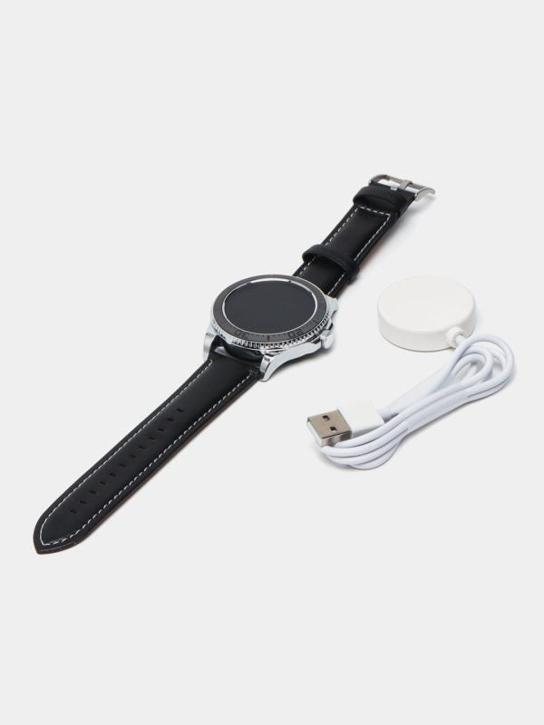 Smartwatch with black leather strap, USB cable, and charging dock on a white background