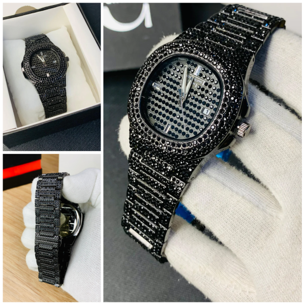 Black diamond-encrusted watch on a white surface with close-up details.