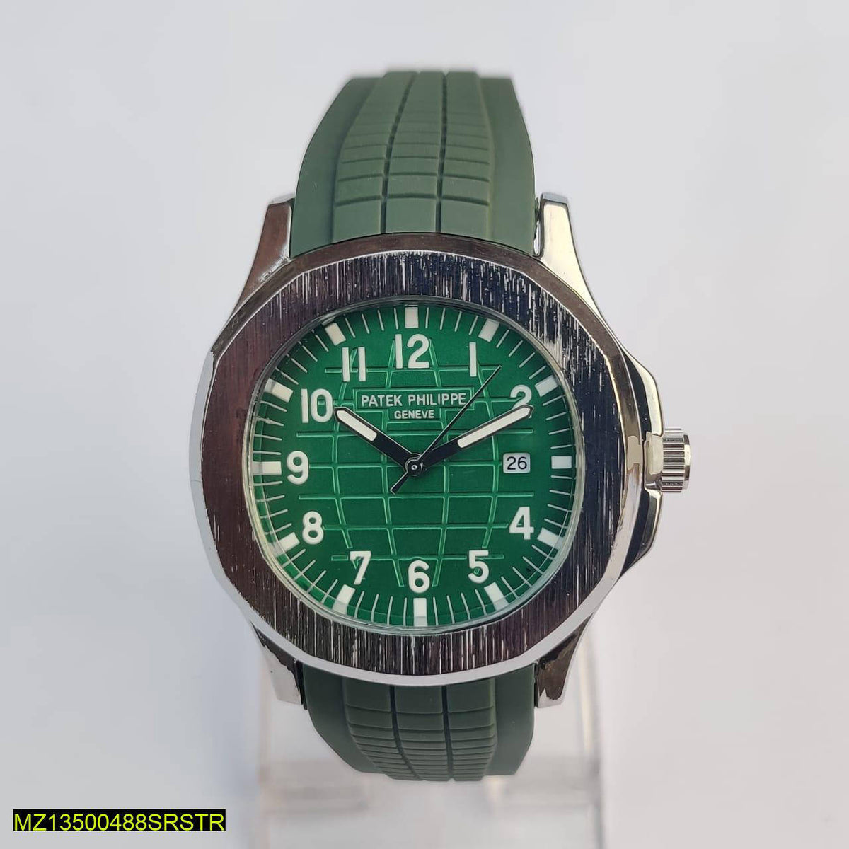 Green watch with a detailed face on a white background