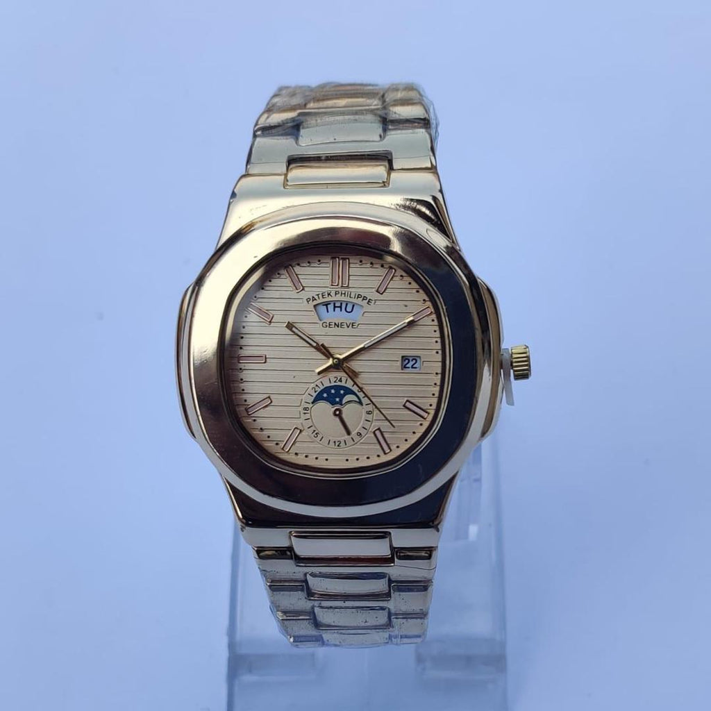 Silver watch with a detailed face on a light blue background