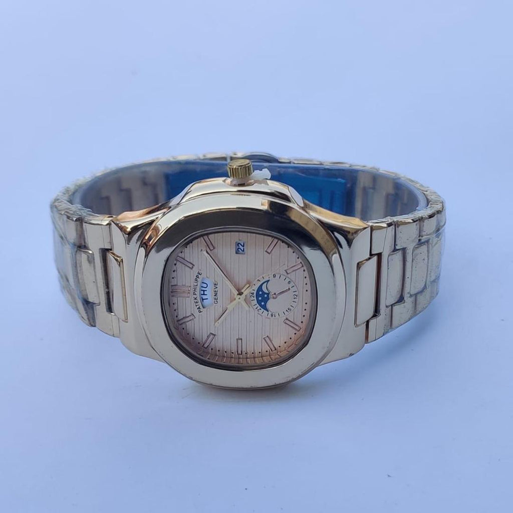 Silver wristwatch with detailed face on a light blue background